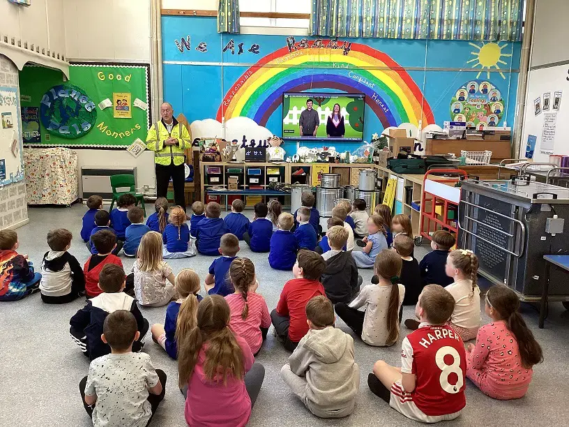 A school assembly where an Airedale team member talks pupils through their new school kitchen
