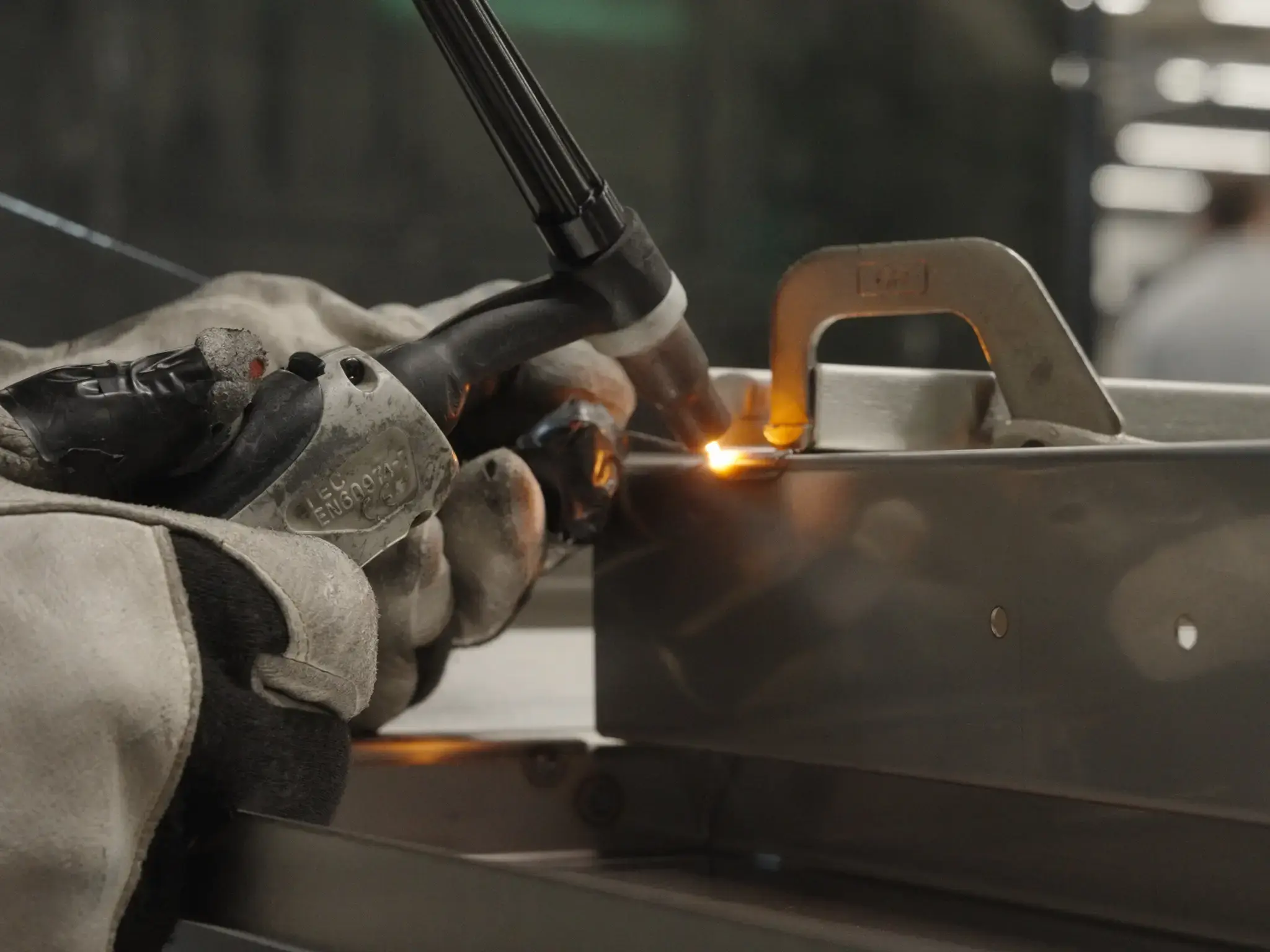 a welder working on bespoke catering equipment