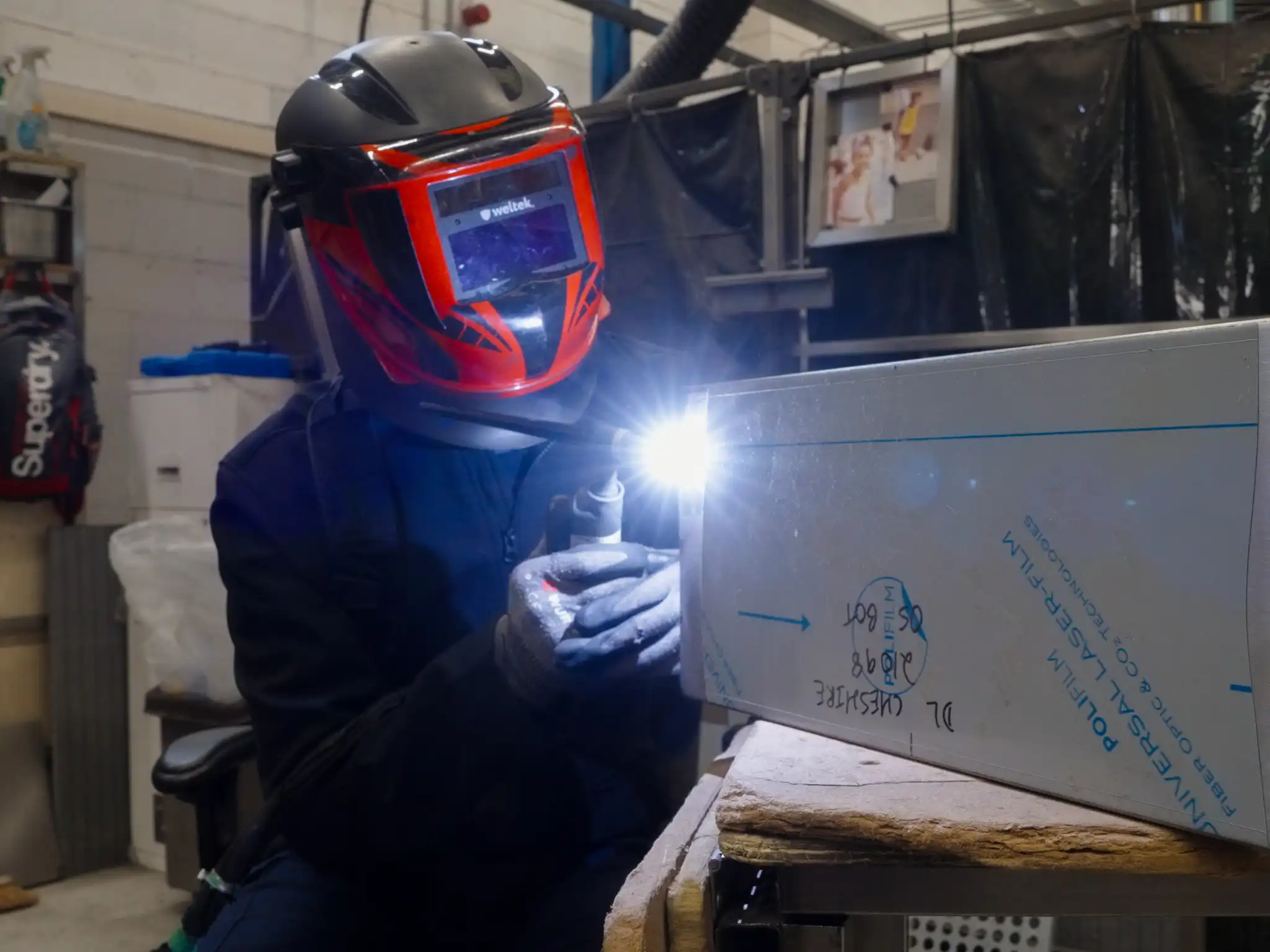 a welder working on bespoke catering equipment